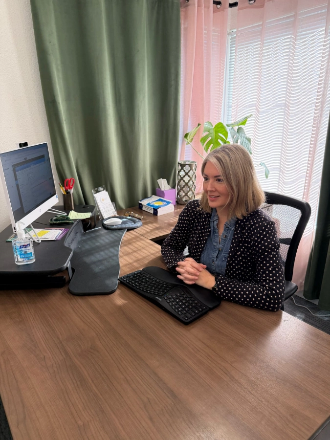 Karen Rightler, PMHNP-BC, a lead mental health professional at her desk in the Solandis Lake Forest office.